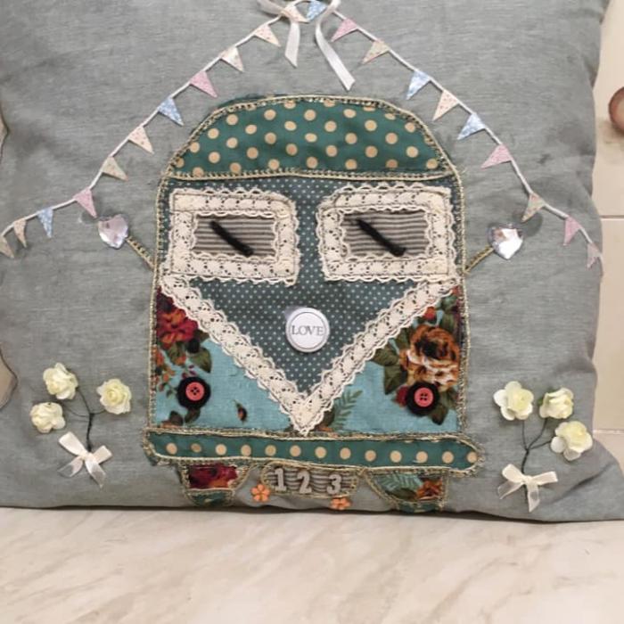 Handmade Sofa Cushion With Ribbons And A Tram